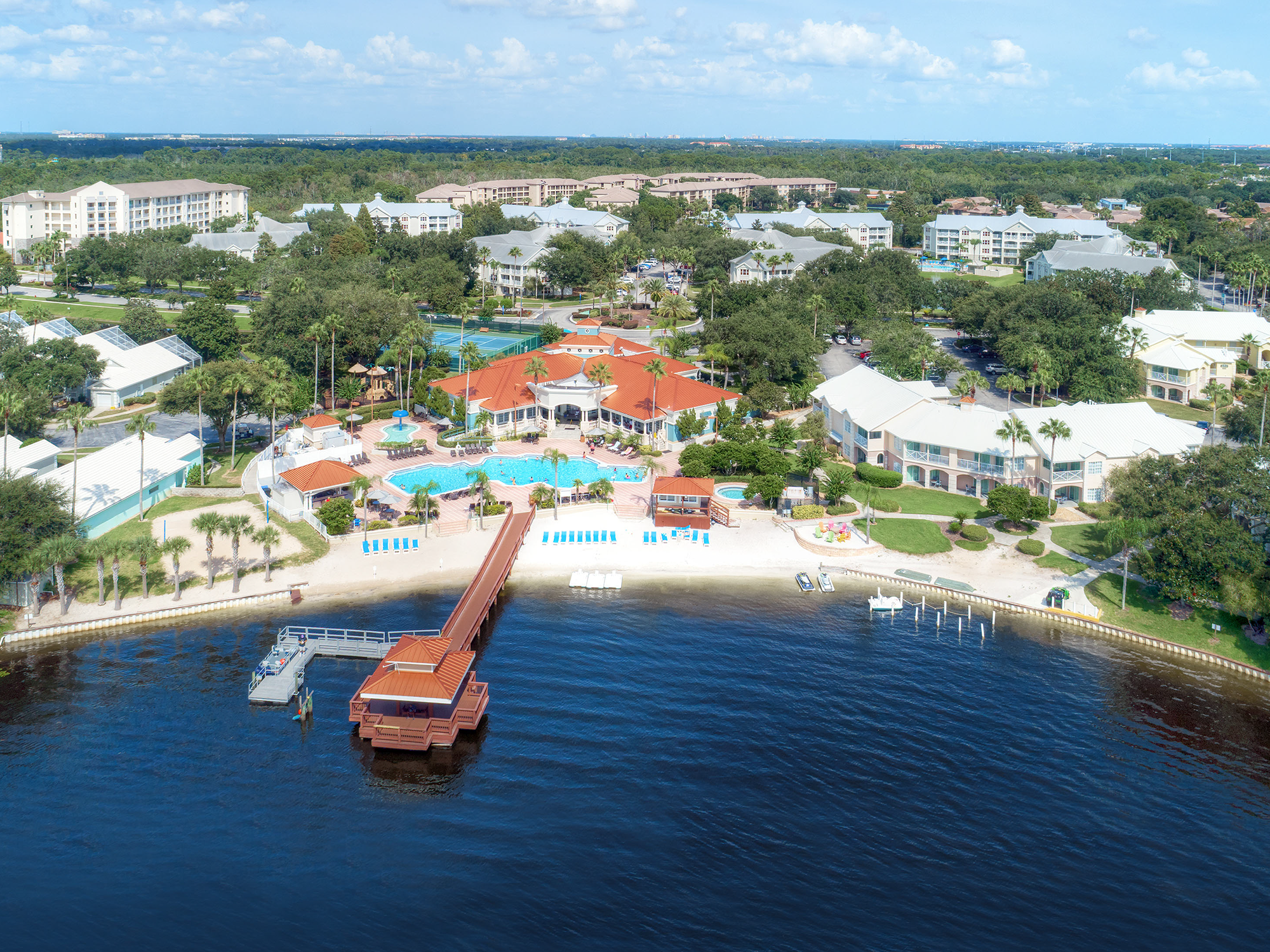 Aerial view of the summer bay orlando waterfront resort with docks and pools.